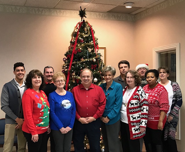 Your credit union staff in front of the tree. Merry CHRISTMAS and Happy Holidays!
